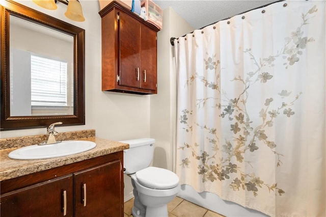 full bathroom with vanity, a textured ceiling, shower / bath combo, tile patterned flooring, and toilet