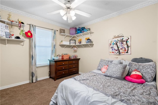 carpeted bedroom with ceiling fan and ornamental molding