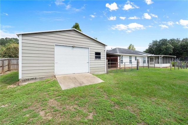 exterior space with a garage and a yard