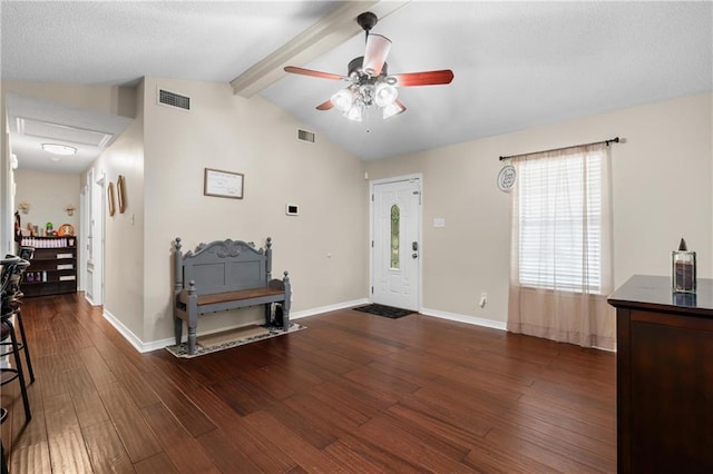 entrance foyer featuring lofted ceiling with beams, ceiling fan, and dark hardwood / wood-style flooring