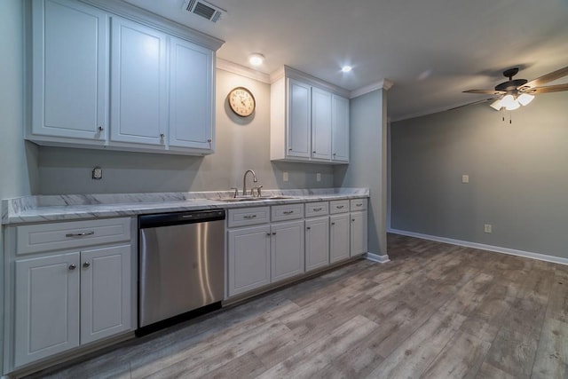 7520 Oak Dr W, Theodore, AL 36582 - kitchen featuring sink, white cabinets, stainless steel dishwasher, ceiling fan, and light hardwood / wood-style floors