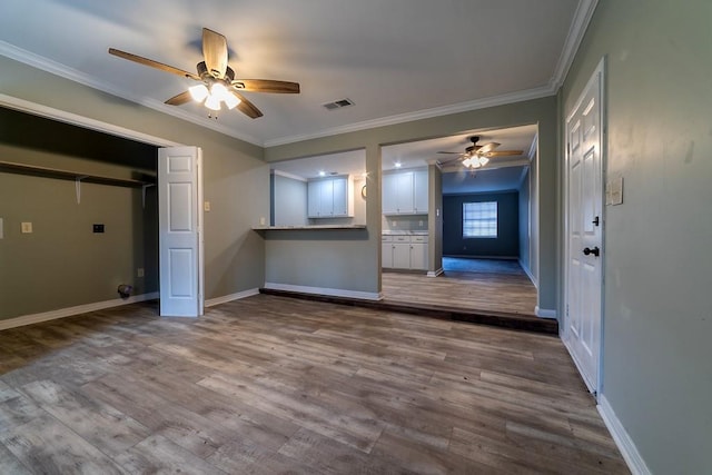 7520 Oak Dr W, Theodore, AL 36582 - unfurnished living room with hardwood / wood-style floors, ornamental molding, and ceiling fan