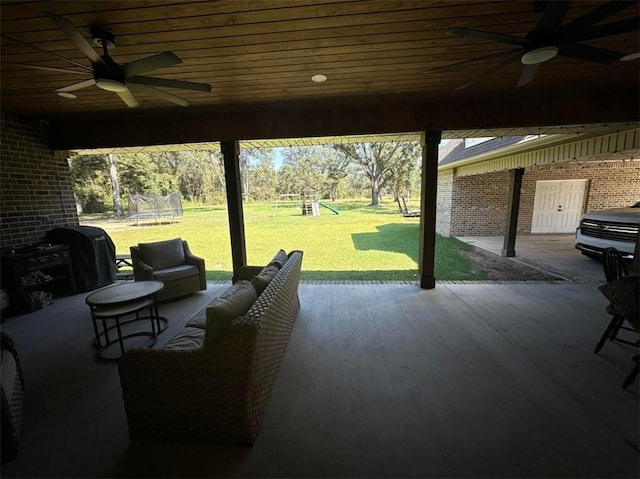 view of patio featuring a ceiling fan, a playground, and a trampoline