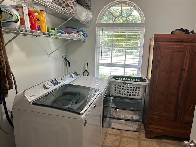 laundry area with washing machine and clothes dryer