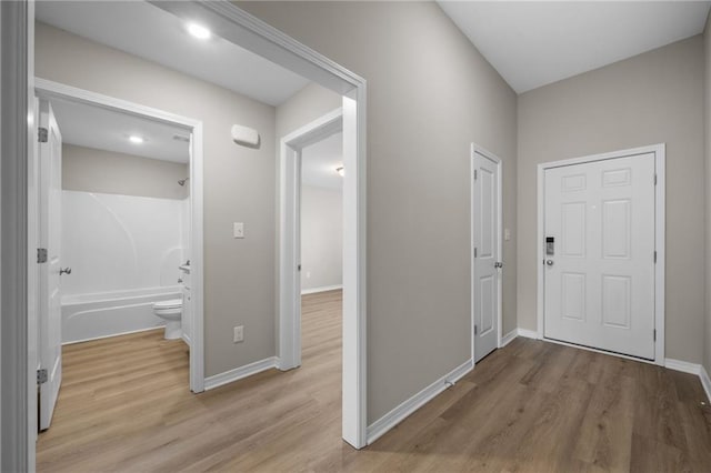 hallway featuring light hardwood / wood-style flooring