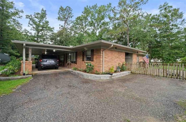 3120 Riviere Du Chien Loop W, Mobile, AL 36693 - view of front of home with driveway, a carport, and brick siding