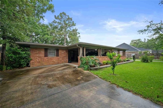 3120 Riviere Du Chien Loop W, Mobile, AL 36693 - ranch-style house featuring a porch, a front lawn, brick siding, and concrete driveway