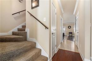 267 Galaxy St, Fairhope, AL 36532 - stairs with crown molding and wood finished floors