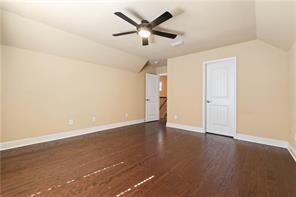 267 Galaxy St, Fairhope, AL 36532 - additional living space with lofted ceiling, dark wood finished floors, baseboards, and ceiling fan