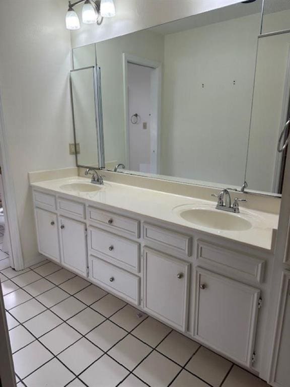 bathroom with vanity, tile patterned floors, and toilet