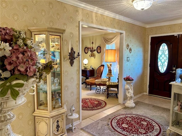 tiled entryway with ornamental molding and a textured ceiling