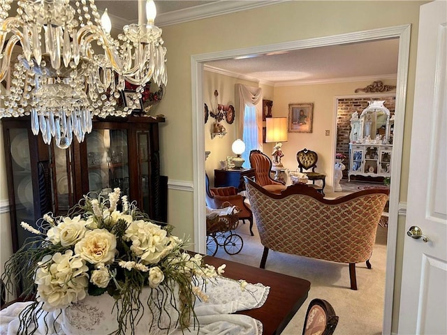 dining room featuring carpet, ornamental molding, and a notable chandelier