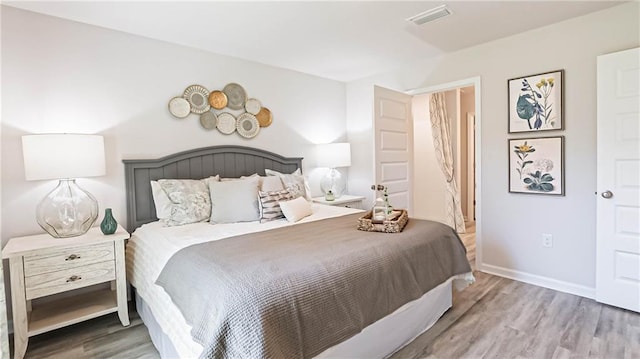 bedroom with wood-type flooring