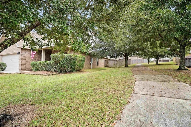 view of yard with a garage