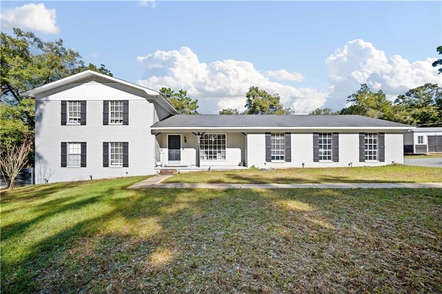 view of front of house with a porch and a front yard