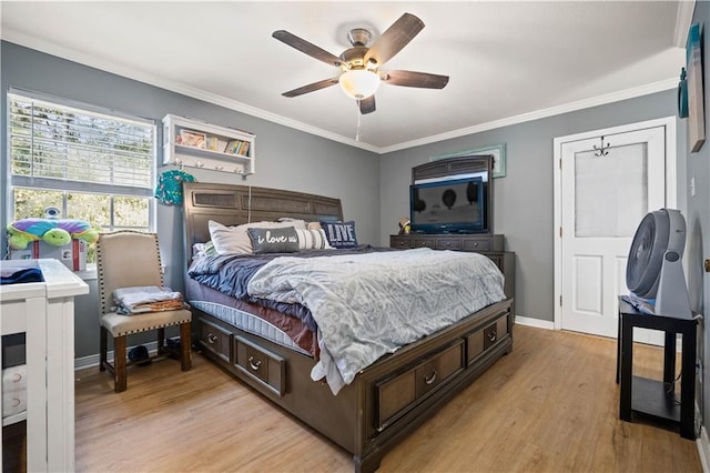 bedroom featuring ceiling fan, light wood-type flooring, and ornamental molding