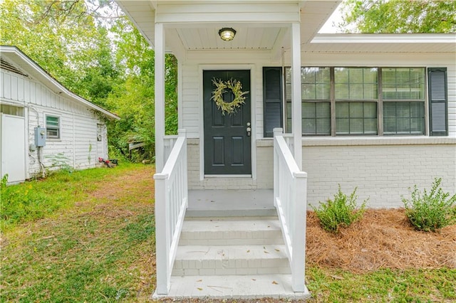 doorway to property featuring covered porch