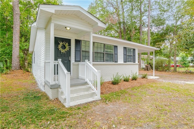 view of front of property featuring covered porch