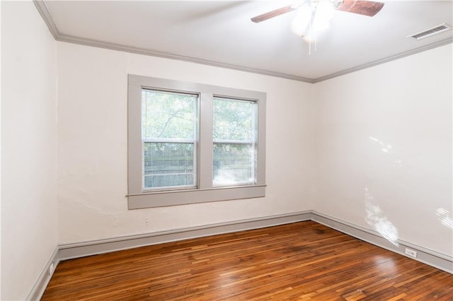 spare room featuring hardwood / wood-style flooring, ceiling fan, and crown molding