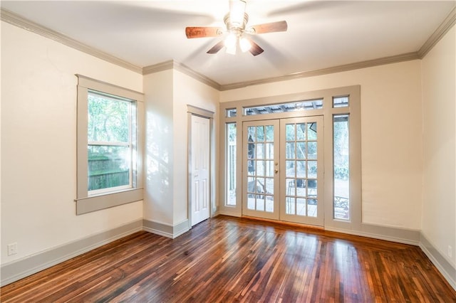 doorway to outside featuring french doors, crown molding, ceiling fan, and dark wood-type flooring