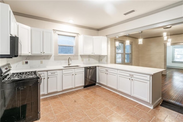 kitchen with kitchen peninsula, sink, white cabinets, and black appliances