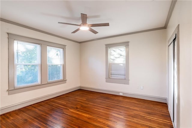 unfurnished room with ceiling fan, dark hardwood / wood-style floors, and ornamental molding