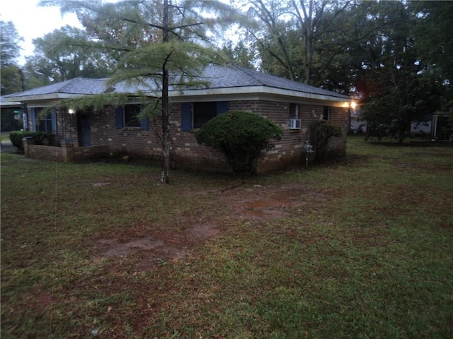 view of property exterior with a yard