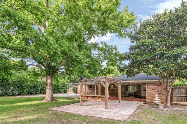 back of house featuring a pergola and a patio