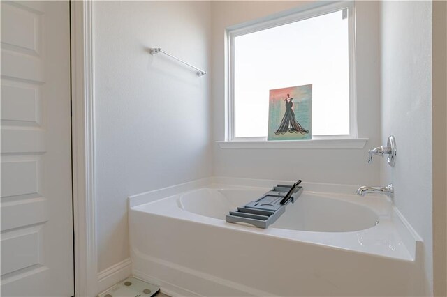 full bathroom with a bath