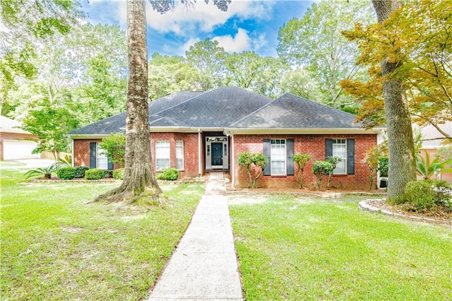 ranch-style house featuring a front lawn