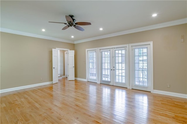 spare room with french doors, light hardwood / wood-style flooring, ceiling fan, and crown molding