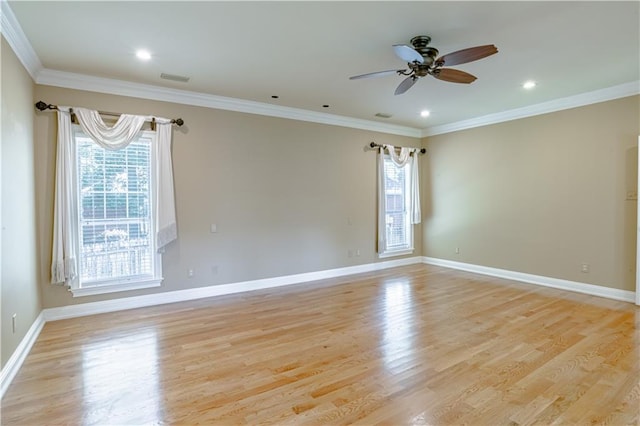 spare room featuring ceiling fan, light hardwood / wood-style floors, and ornamental molding