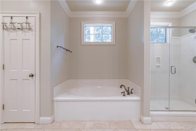 bathroom with plenty of natural light, shower with separate bathtub, and ornamental molding