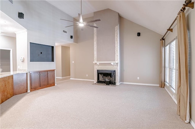 unfurnished living room with ceiling fan, a fireplace, light colored carpet, and lofted ceiling