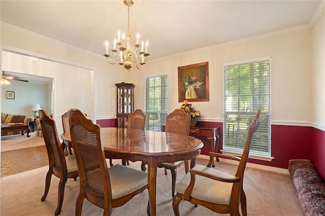 dining space with an inviting chandelier, light carpet, and ornamental molding
