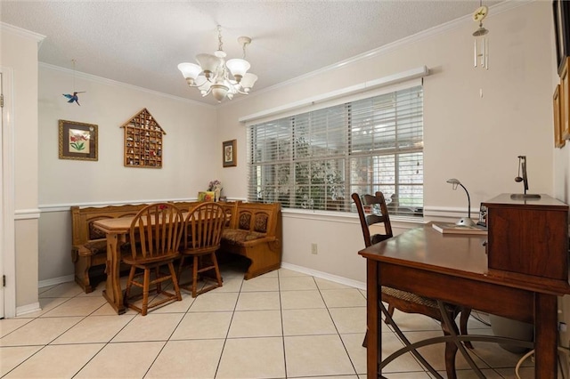 dining room with crown molding, a notable chandelier, a textured ceiling, baseboards, and light tile patterned floors