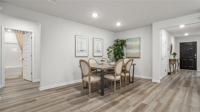 10471 Lowell St W, Mobile, AL 36695 - dining room with light wood finished floors, baseboards, and recessed lighting