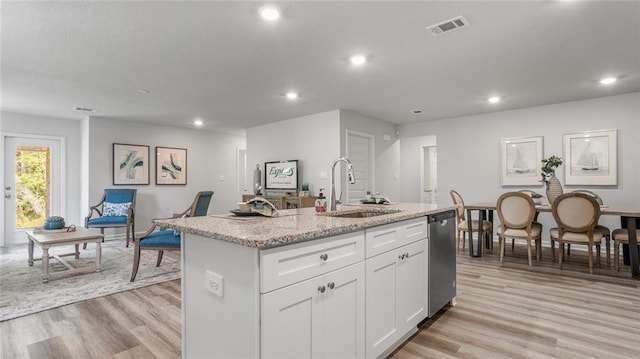 10471 Lowell St W, Mobile, AL 36695 - kitchen with a sink, stainless steel dishwasher, recessed lighting, light wood-type flooring, and white cabinets
