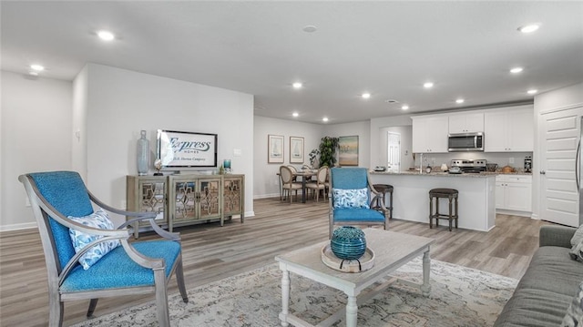 10471 Lowell St W, Mobile, AL 36695 - living area featuring light wood-style floors, recessed lighting, and baseboards