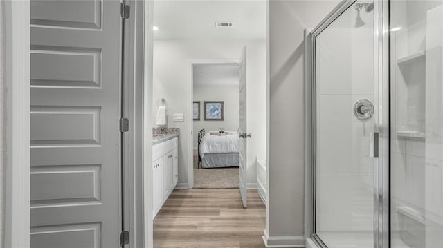 10471 Lowell St W, Mobile, AL 36695 - ensuite bathroom featuring wood finished floors, vanity, and a shower stall