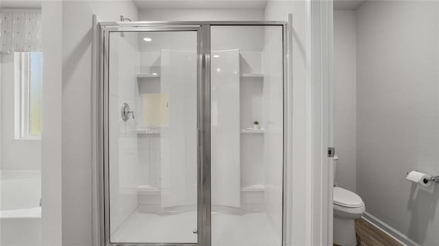10471 Lowell St W, Mobile, AL 36695 - bathroom featuring toilet, a bath, and a shower stall
