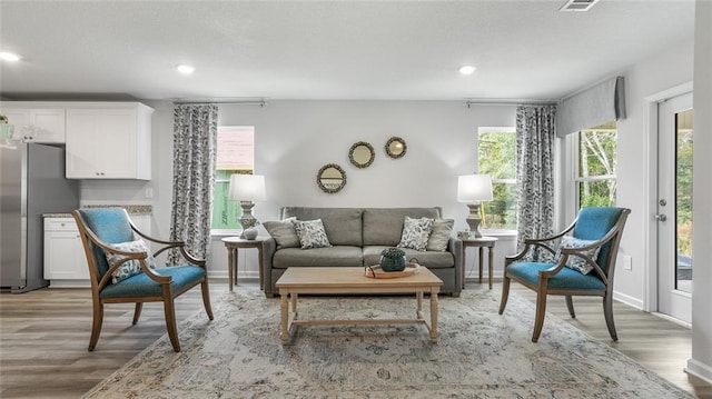 10471 Lowell St W, Mobile, AL 36695 - living area featuring light wood-type flooring, recessed lighting, and baseboards
