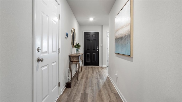 10471 Lowell St W, Mobile, AL 36695 - doorway featuring wood finished floors and baseboards