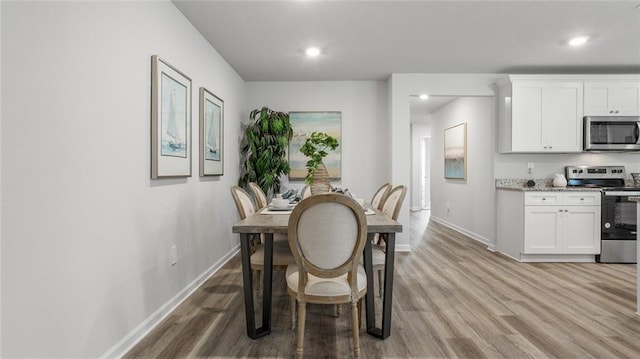 10471 Lowell St W, Mobile, AL 36695 - dining room featuring light wood-style flooring, baseboards, and recessed lighting