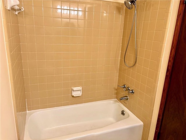 bathroom with shower / washtub combination
