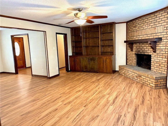 unfurnished living room featuring a ceiling fan, baseboards, ornamental molding, and wood finished floors