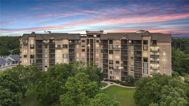 view of outdoor building at dusk