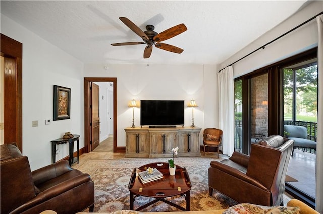 tiled living room with ceiling fan