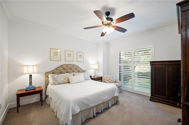 carpeted bedroom with access to exterior, ceiling fan, and crown molding