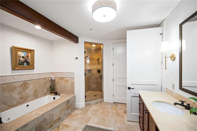 bathroom featuring beam ceiling, vanity, and separate shower and tub